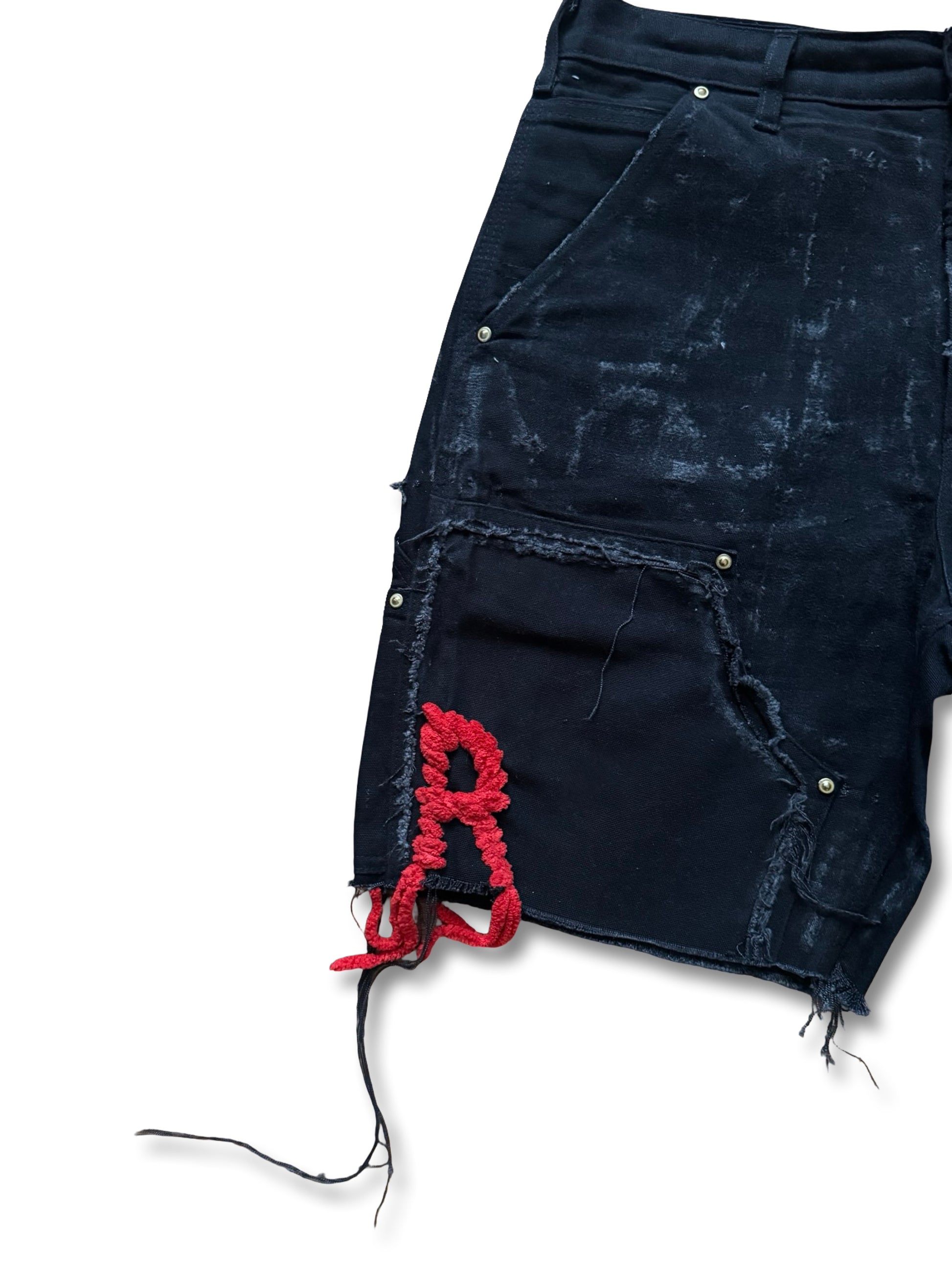 Double knee distressed foil R stitched short.